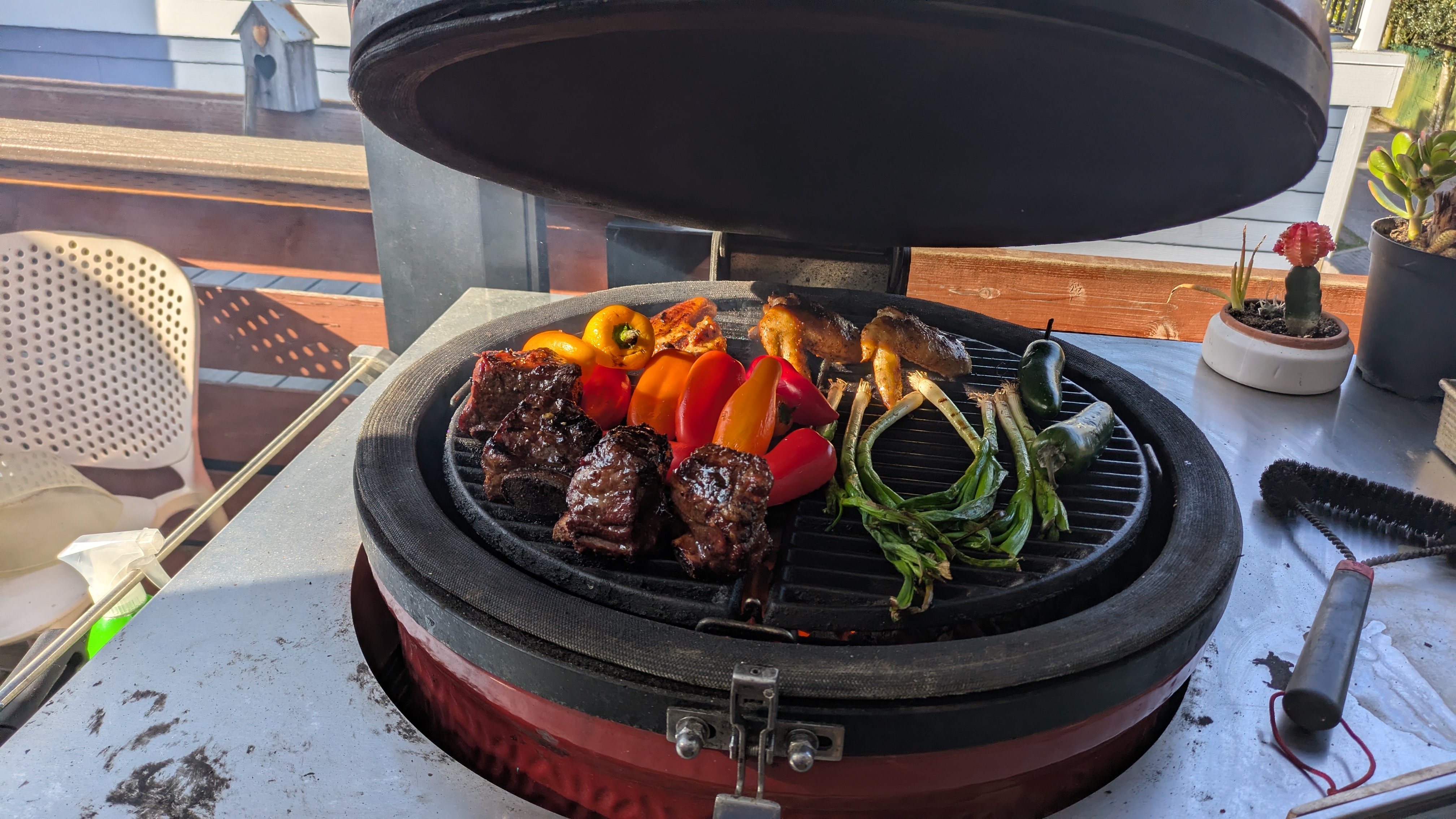 Full grill - wings, ribs, peppers, scallions on the Kamado