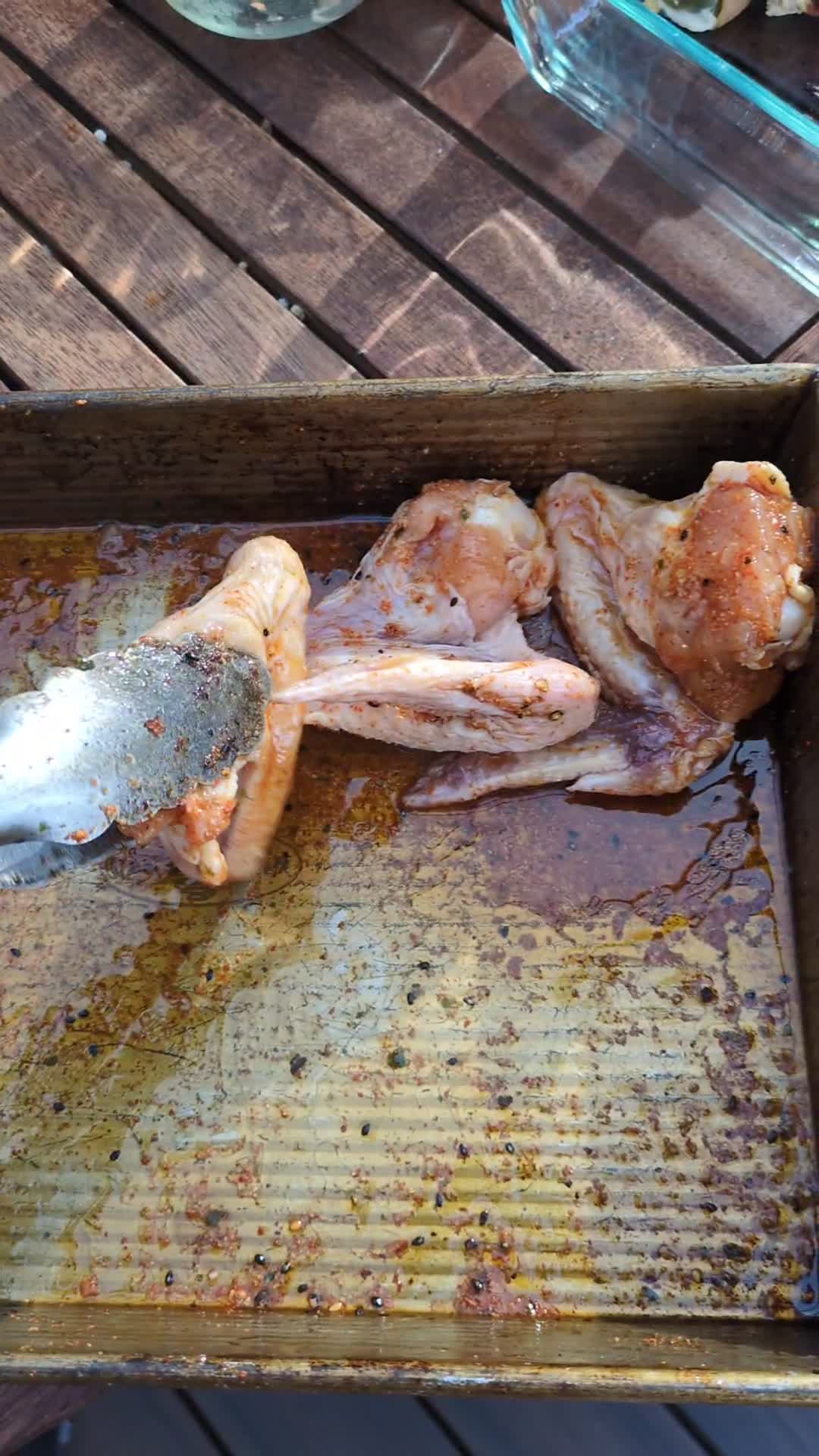 Finished whole wings resting on sheet pan